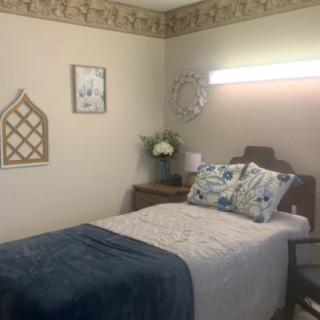 Cozy bedroom with elegant decor and a neatly made bed.