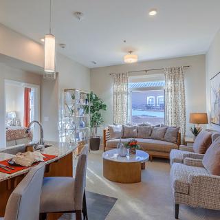 A modern living room with stylish furniture and natural lighting.