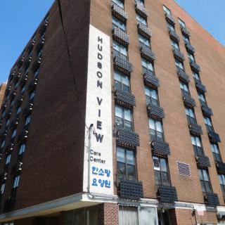 Hudson View apartment building with a prominent vertical sign.