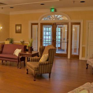 A cozy living room with comfortable seating and wooden flooring.