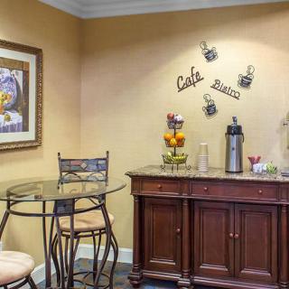 Cozy coffee station with decorative elements and seating.