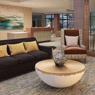 A modern living room with stylish furniture and contemporary artwork.