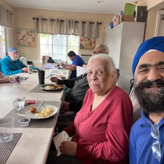 Enjoying a meal together in a lively communal setting.
