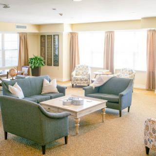 A bright living room with cozy sofas and a coffee table.
