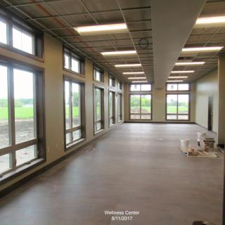 A spacious, modern interior with large windows allowing ample natural light.