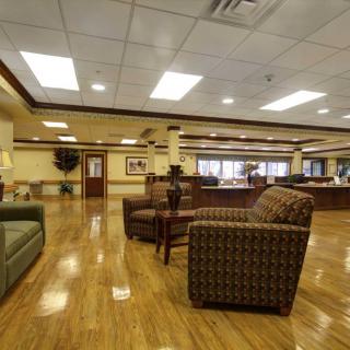 A spacious lobby with comfortable seating and elegant interior design.