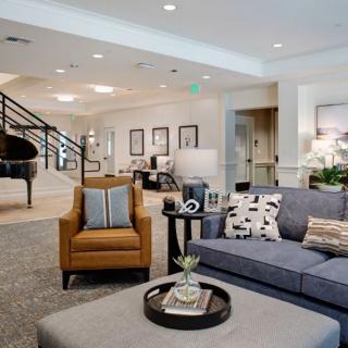 A modern living room with comfortable seating and elegant decor.