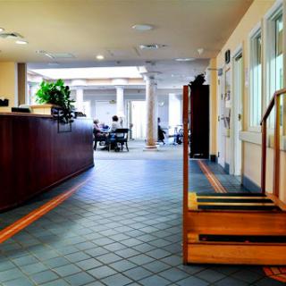 A welcoming lobby area featuring a reception desk and an open seating arrangement.