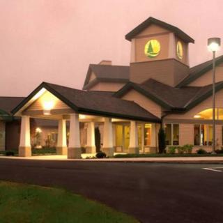 Exterior view of a hotel building illuminated at night.