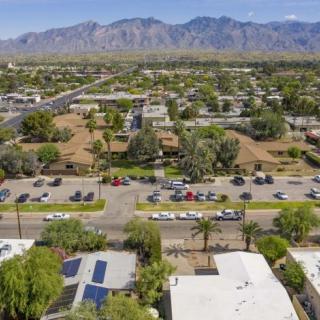 Aerial view of a suburban neighborhood with mountains in the background.