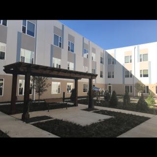 A view of a residential courtyard with modern architecture.