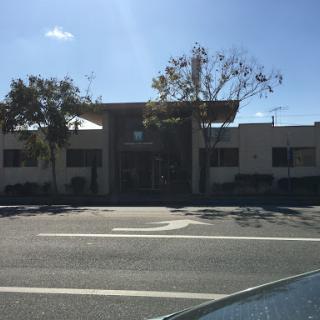 A modern commercial building captured during the day.