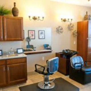 A well-organized salon interior featuring a barber chair and stylish decor.