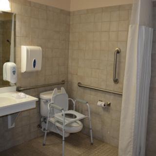 An accessible bathroom equipped with safety features.