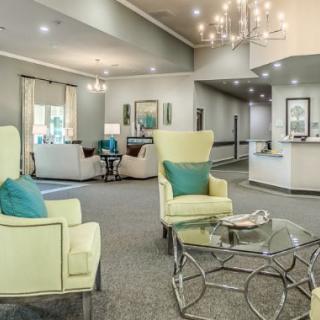 A modern living room with comfortable seating and elegant lighting.