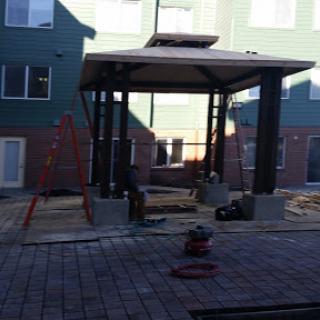 A gazebo under construction in an outdoor setting.