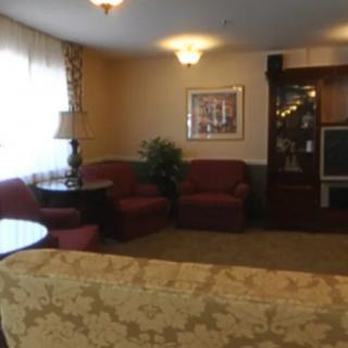 A cozy living room with comfortable seating and a television.