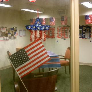 An office decorated with American flags and patriotic decor.