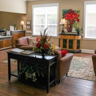 A cozy living room with elegant furniture and warm decor.