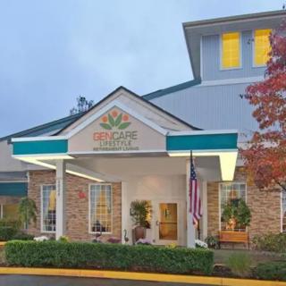 The exterior of a hotel with a prominent entrance and flags displayed.
