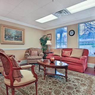 A cozy waiting room with comfortable seating and tasteful decor.