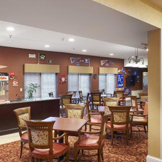 An inviting dining area with neatly arranged tables and chairs, creating a cozy atmosphere.