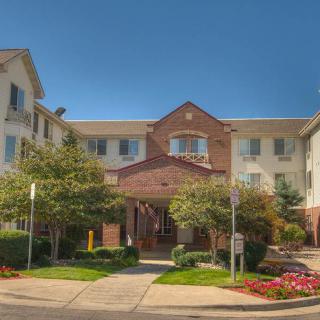 A well-maintained residential building with a welcoming entrance and landscaped surroundings.