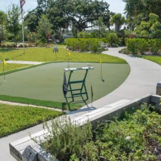 A serene park with lush greenery and winding pathways.
