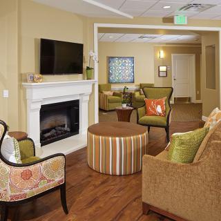 A cozy and modern living room with a fireplace and comfortable seating.