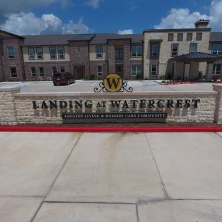 Entrance sign of Landing at Watercrest apartment complex.