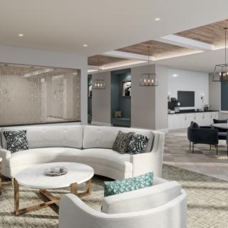 A modern open-concept living room with sleek furniture and contemporary decor.