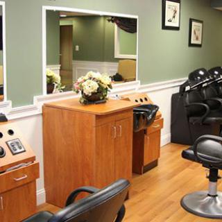 A well-designed hair salon interior with styling chairs and mirrors.