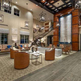 A modern hotel lobby featuring stylish seating and elegant lighting.