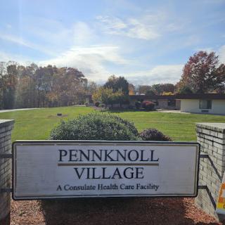 Entrance to Pennknoll Village, a health care facility, set in a serene outdoor environment.