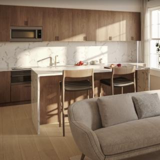 A modern, minimalist kitchen with a central island and wood cabinetry.