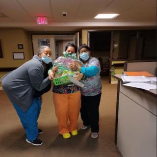 Healthcare staff celebrating with a thoughtful gift.