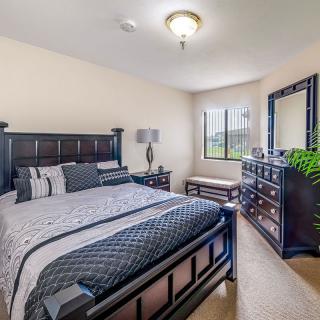 A well-appointed bedroom with elegant furniture and decor.