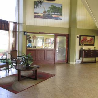 A spacious hotel lobby with classic decor and comfortable seating.