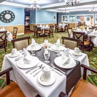 A beautifully set dining table in an elegant restaurant.