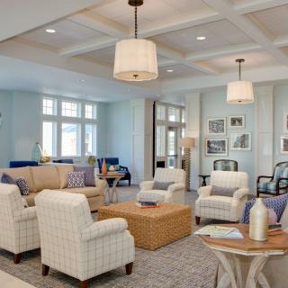 A modern living room with elegant furnishings and soft lighting.
