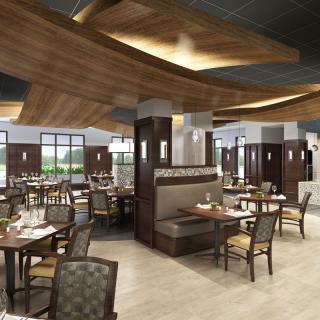 A modern restaurant interior with stylish seating and wooden accents.