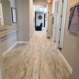 A modern indoor hallway with bright flooring and stylish decor.