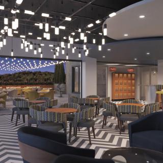A modern restaurant interior featuring unique lighting fixtures and stylish dining arrangements.