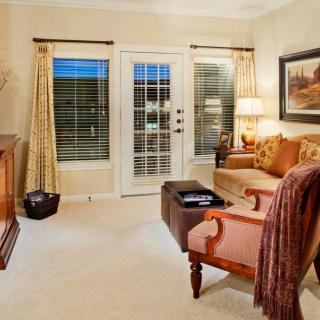 A cozy living room with elegant furniture and soft lighting.
