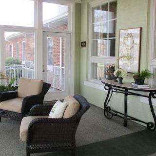 A cozy interior seating area with comfortable chairs and abundant natural light.