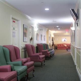 A cozy hallway featuring comfortable chairs, perfect for relaxing or waiting.