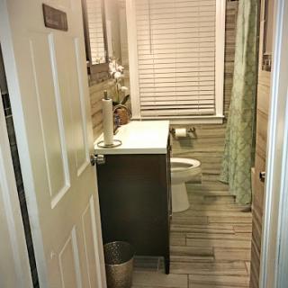 A cozy bathroom featuring modern fixtures and natural light.