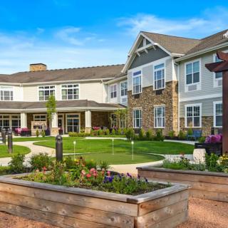 A well-maintained senior living facility with landscaped gardens.