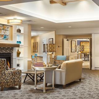 A cozy living room with a fireplace and comfortable seating.