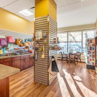 A well-lit store interior featuring cards and gift items on display.